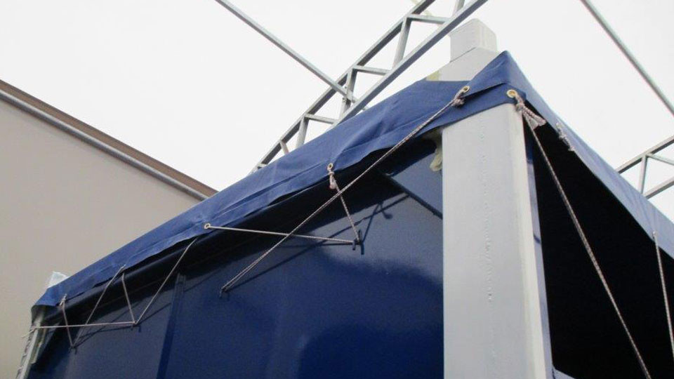 tarp-on-offshore-mini-container